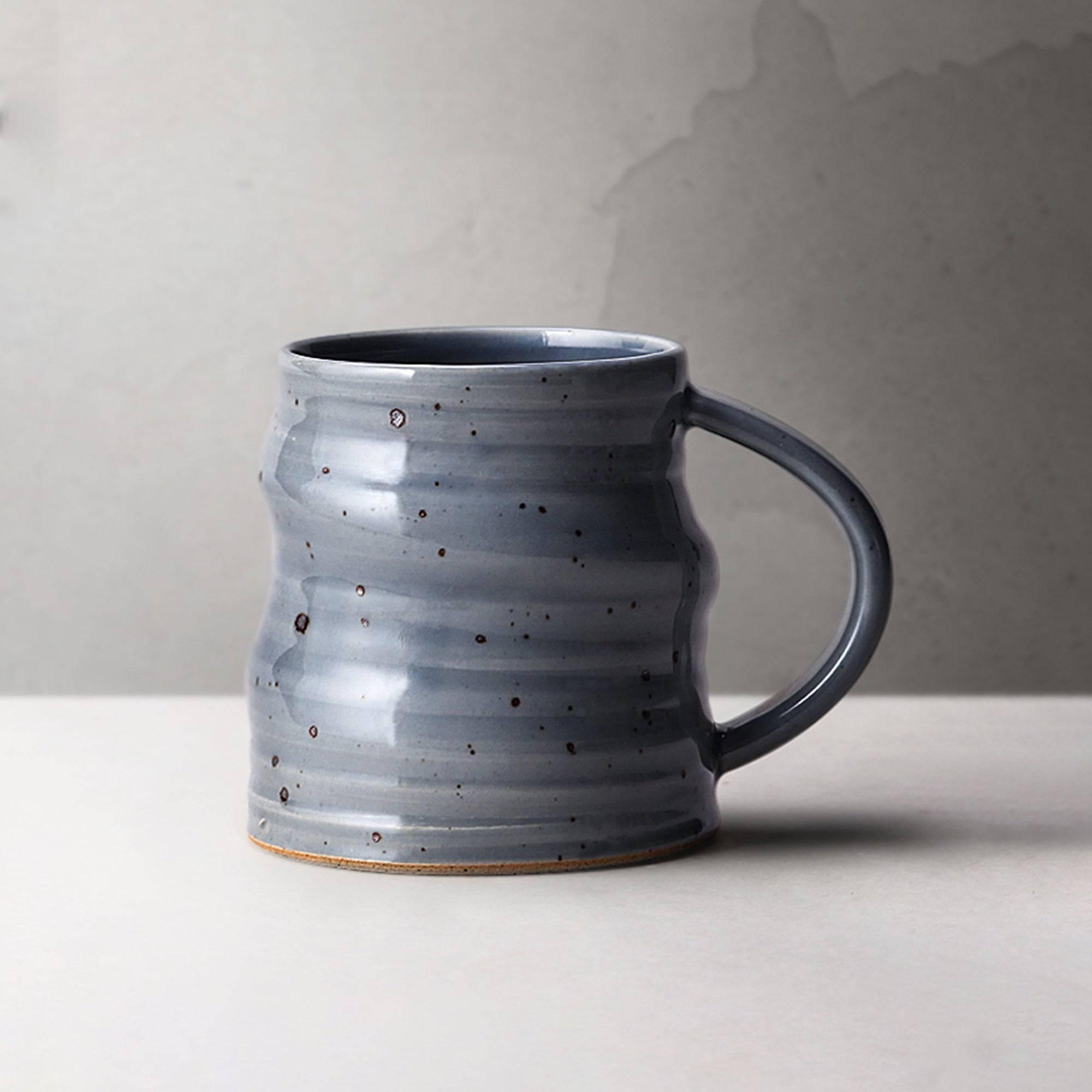 https://eunaliving.com/cdn/shop/products/japanese-style-handmade-rough-pottery-personalized-coffee-cup-eunaliving-6.jpg?v=1661417884